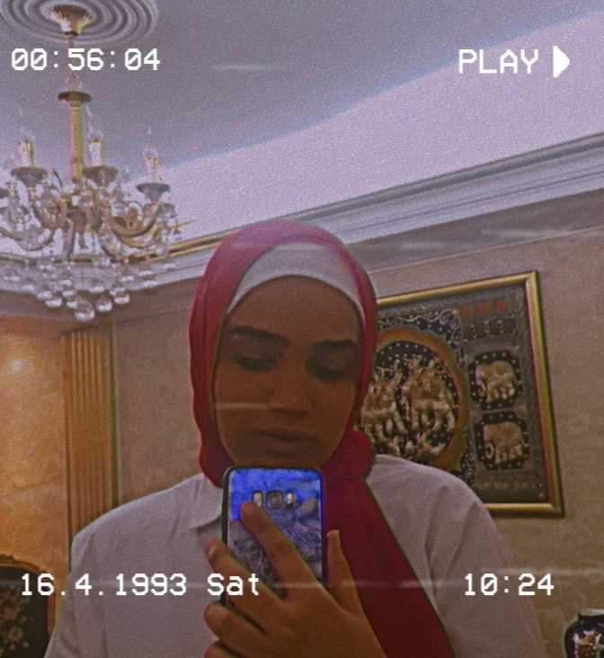 Mirror selfie of Nour Walaa indoors