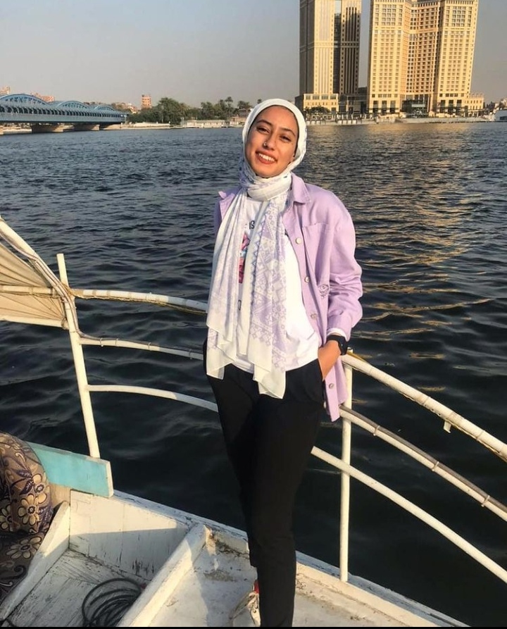 Salma Mohamed standing on a boat on the redsea in the morning